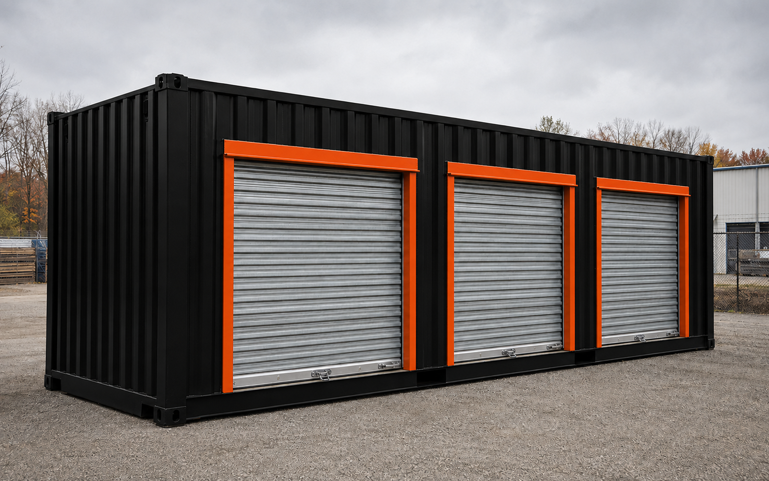 Black shipping container with a reinforced orange commercial roll-up door